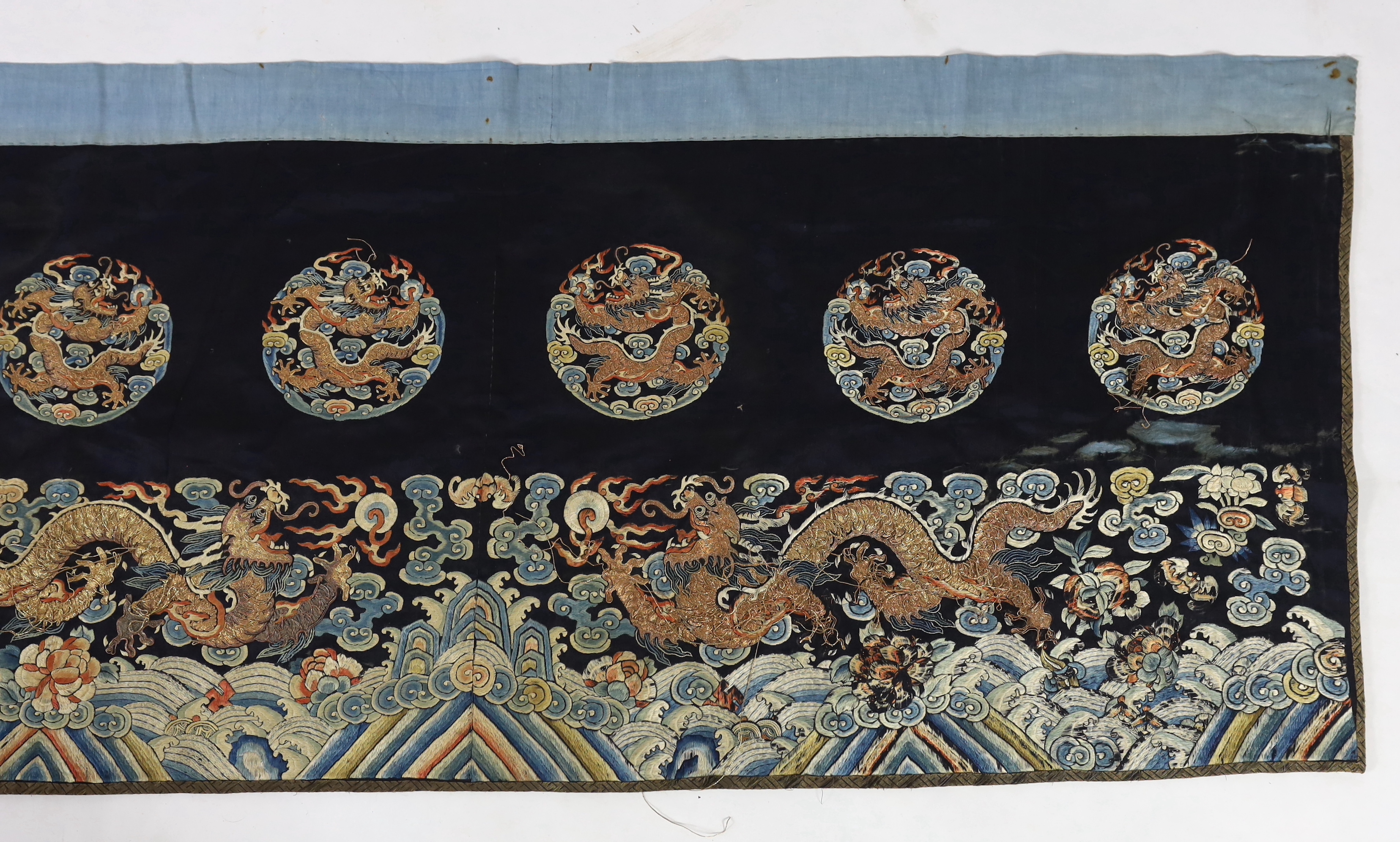 A Chinese embroidered silk 'dragon' table frontal, 19th century, damage